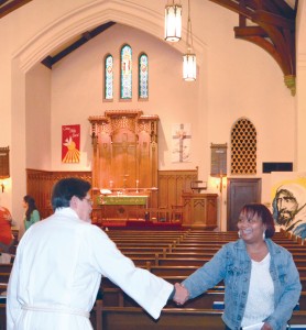 Vicar James Kirschenmann shares God’s peace with parishioners at a Sunday service in November 2015 at St. Paul’s Lutheran Church—College Hill, St. Louis. Photo: Melanie Ave