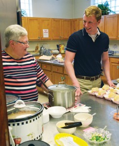 At Epiphany Lutheran Church, Pat Wachter, left, a church member, and Jess Biermann, a first-year Seminary student, serve food at a Lenten supper before Wednesday evening services March 16, 2016. Epiphany, located in the Holly Hills neighborhood of St. Louis, is Biermann’s Resident Field Education (RFE) congregation for the spring quarter.